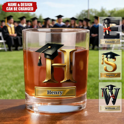 Personalized graduation whiskey glass with custom gold initial and black grad cap design for graduates