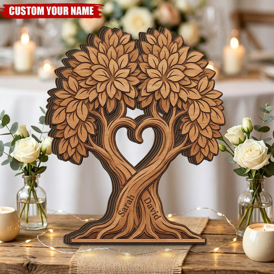 Personalized tree of life wooden plaque with custom couple names carved into an intertwined heart tree design