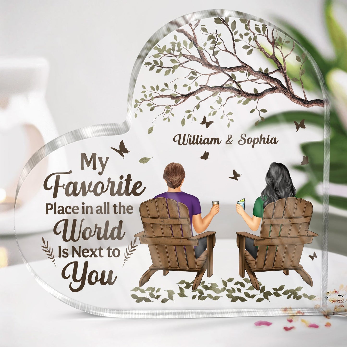 Personalized couples acrylic plaque shaped like a heart featuring custom characters sitting in chairs