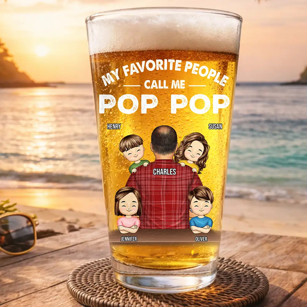 Personalized pop pop beer glass featuring custom illustrated grandkids and grandfather names printed on a 16oz pint glass.