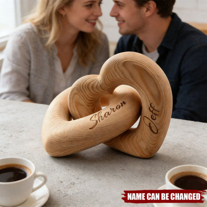 Personalized infinity heart sculpture in natural wood engraved with custom names for couples