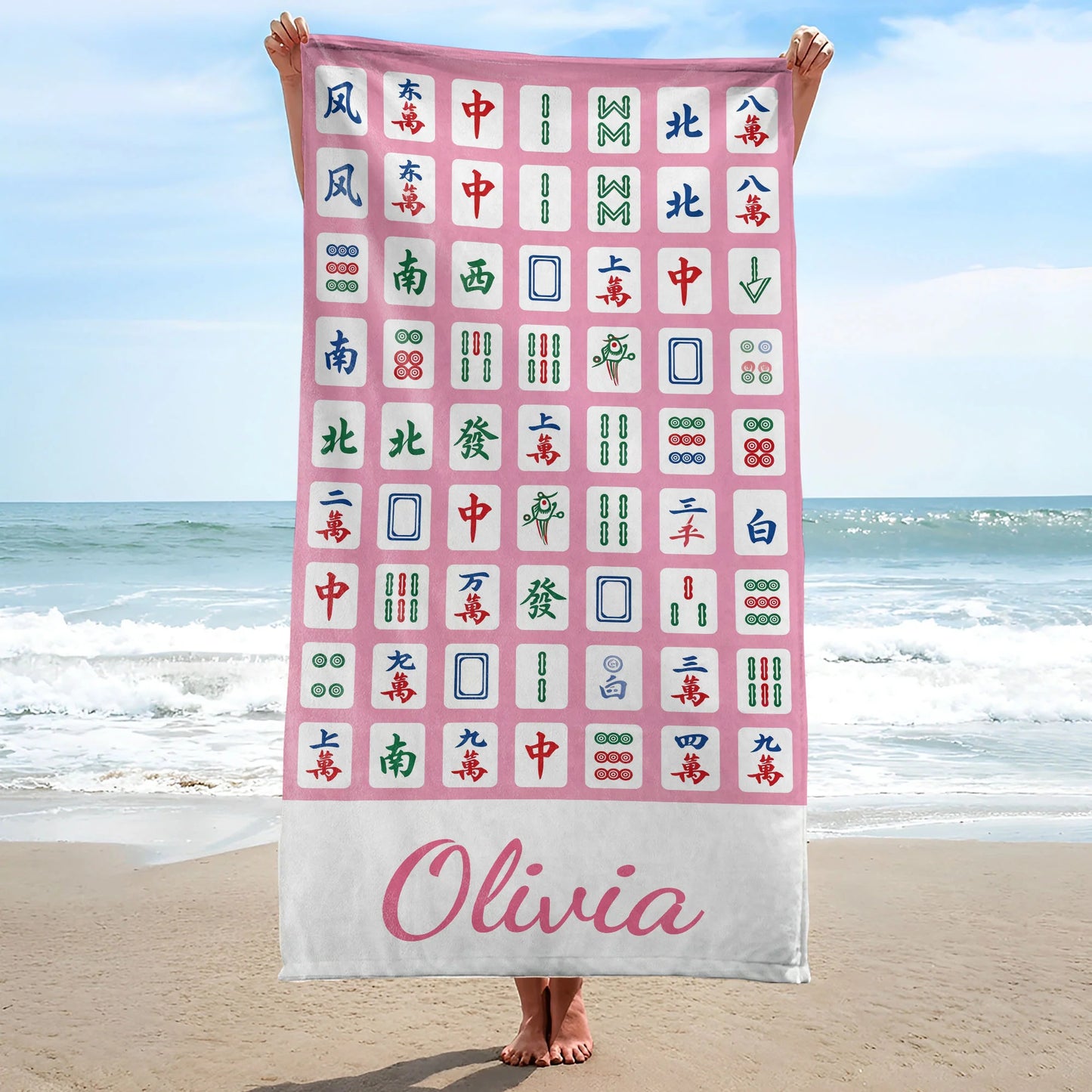 Personalized mahjong beach towel in vibrant pink with custom name print for summer pool days