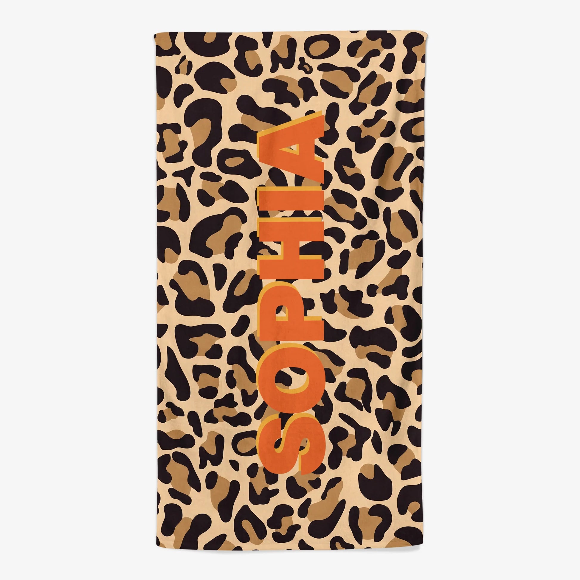 Custom monogram beach towel with personalized name over a trendy leopard print pattern