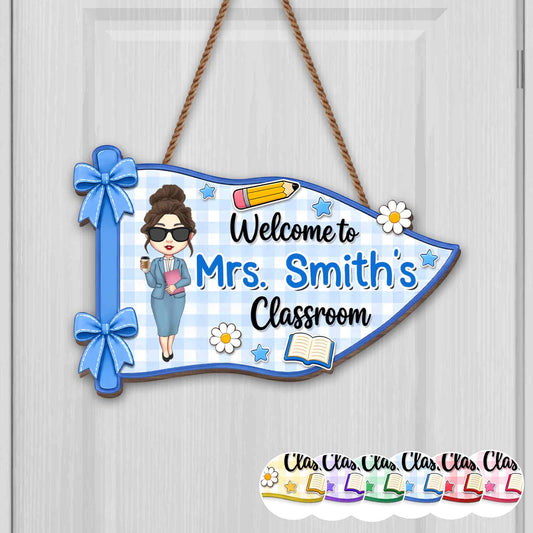 Personalized teacher classroom sign shaped like a blue pennant with a custom avatar and name