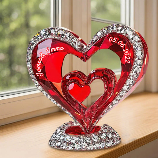 Personalized couple acrylic plaque shaped like intertwined red hearts with custom names and date