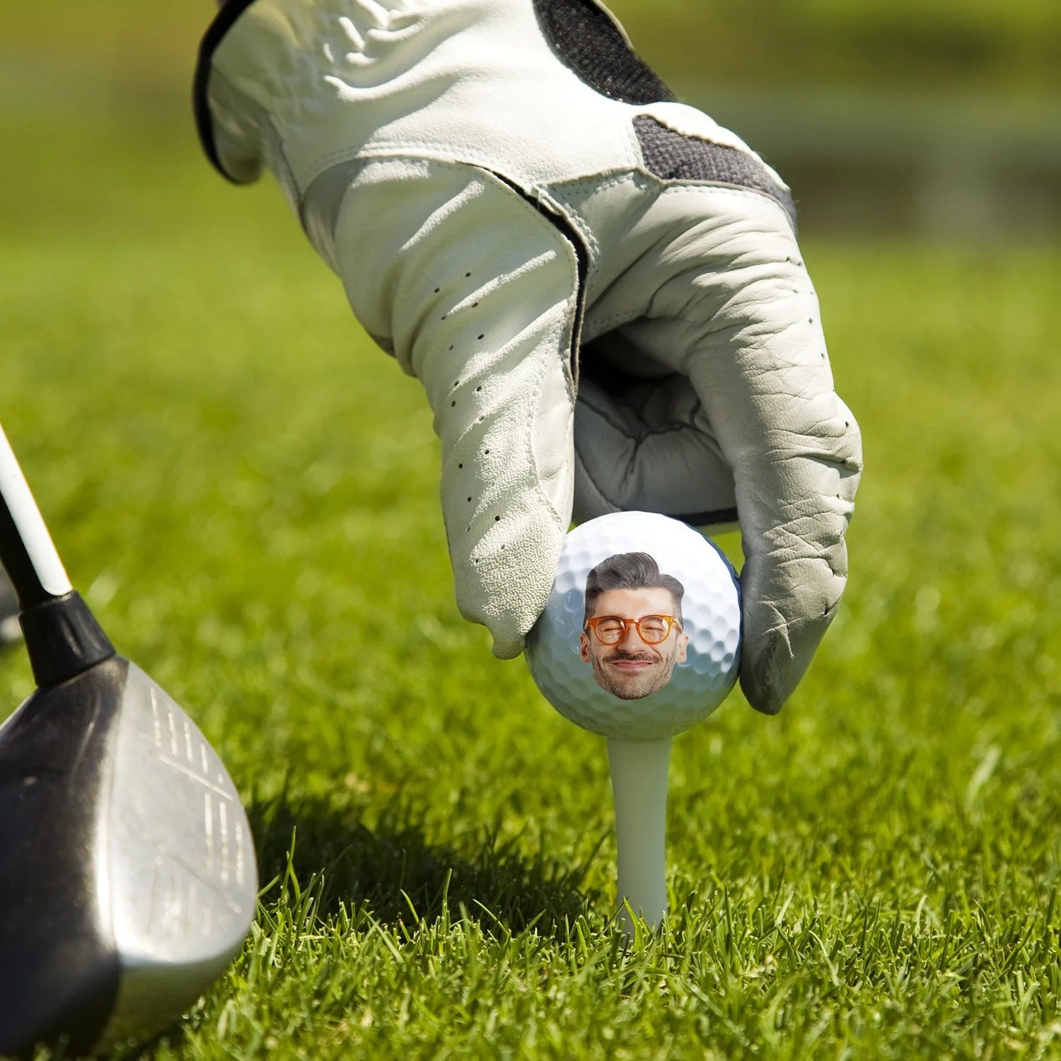 Personalized golf ball with custom photo print and funny text on tee over green grass background image 6