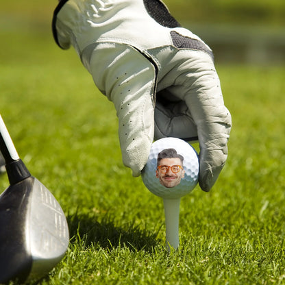 Personalized golf ball with custom photo print and funny text on tee over green grass background image 6