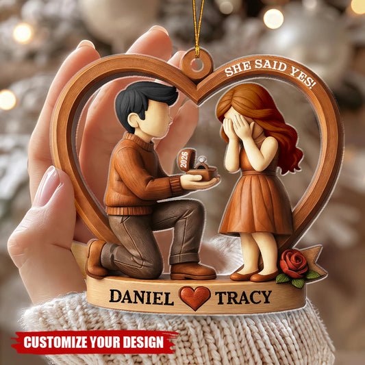Personalized proposal acrylic ornament featuring a custom couple and She Said Yes text for Christmas tree decor