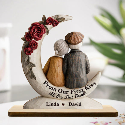 Custom couple anniversary plaque with an elderly couple sitting on a crescent moon with red roses
