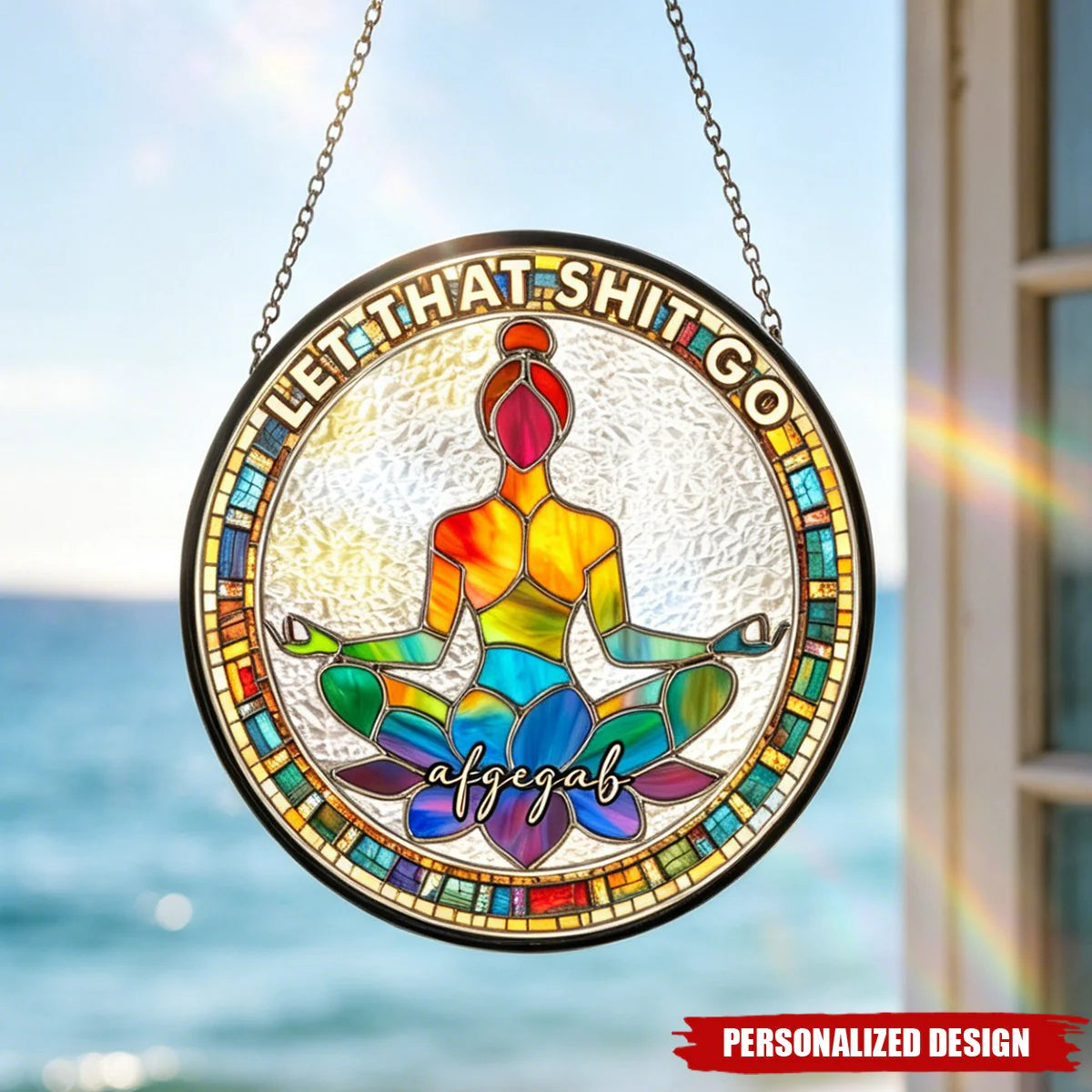 Personalized window hanging suncatcher with custom name and a rainbow yoga meditation design under the sun.