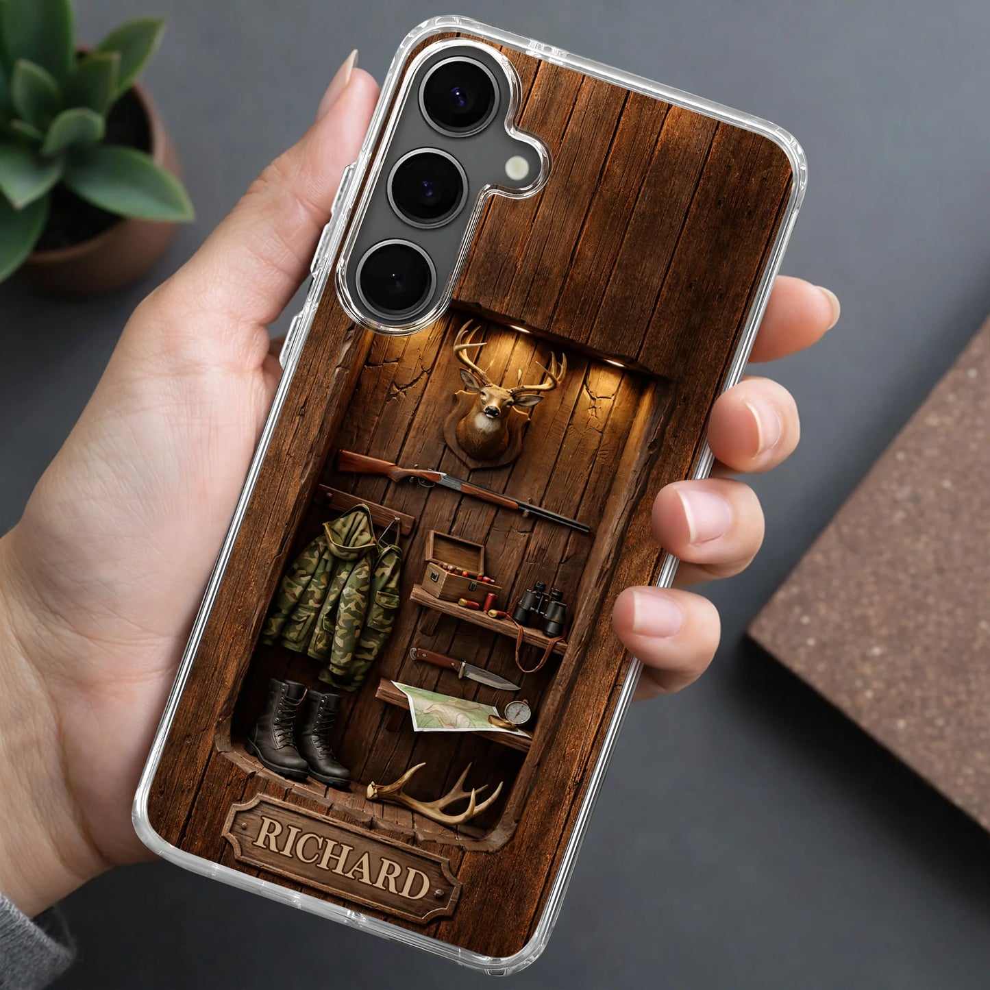 Custom hunting cabin phone case with rustic wood wall, mounted deer head, rifle, camo jacket, and personalized name plate image 8