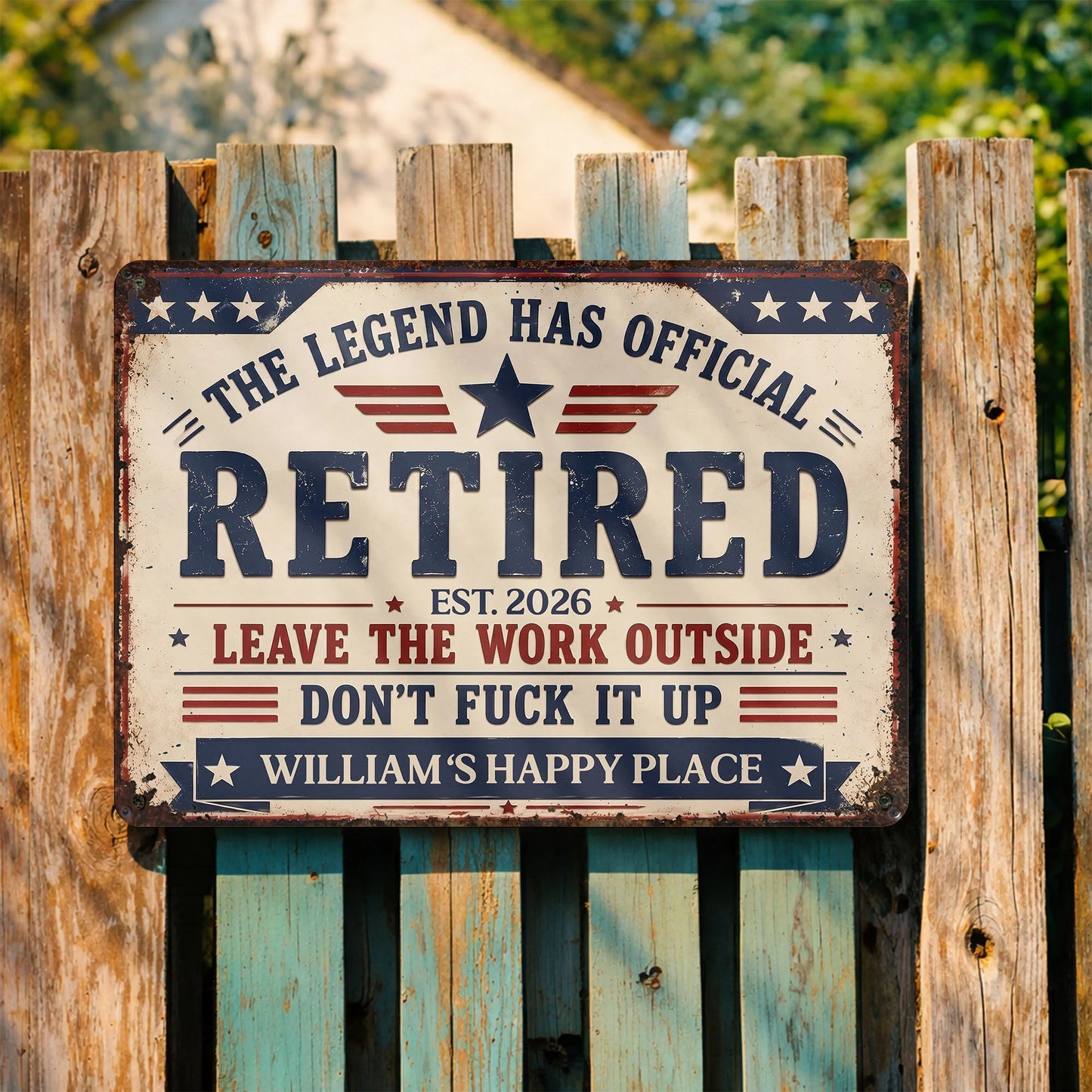 Custom retirement metal sign with stars and stripes reading The Legend Has Official Retired on a wooden fence
