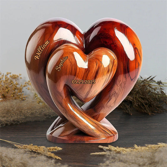 Custom couple acrylic plaque shaped like two interlocking hearts with personalized names and date
