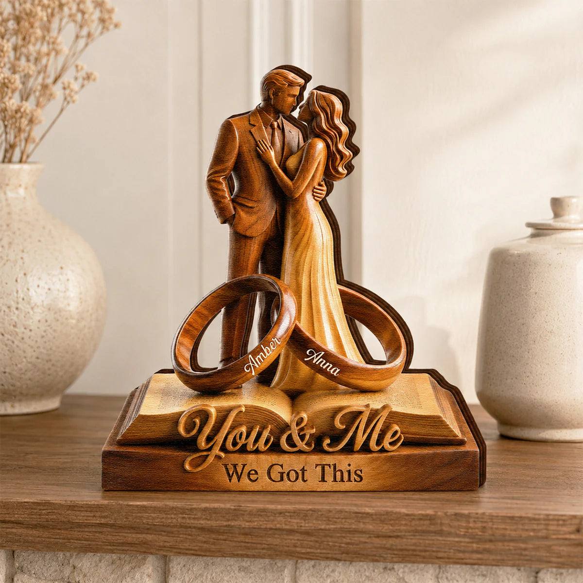Custom couple anniversary plaque featuring two rings engraved with names on a wooden book stand