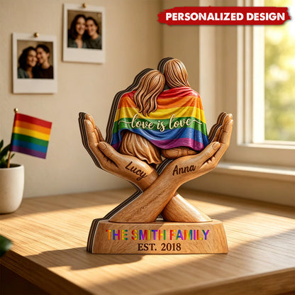 Personalized Pride couple wood plaque with custom names Lucy and Anna wrapped in a rainbow flag