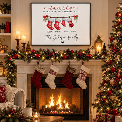 Family Is The Greatest Christmas Gift canvas with names on stockings above a decorated mantel