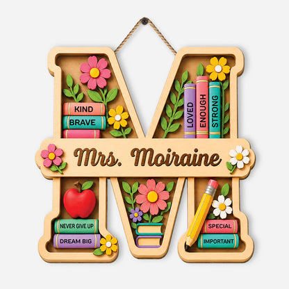 Personalized teacher monogram wood sign shaped like letter M with books and flowers for classroom door decor