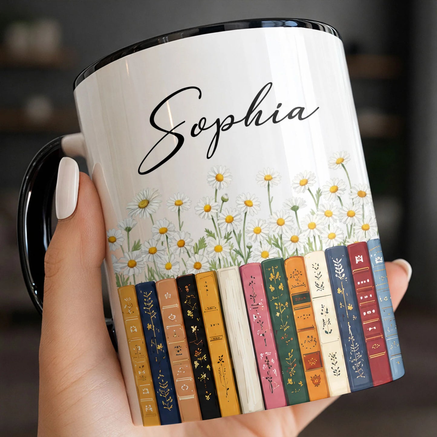 Personalized teacher coffee mug with custom name print, colorful library books, and beautiful white daisy flowers.