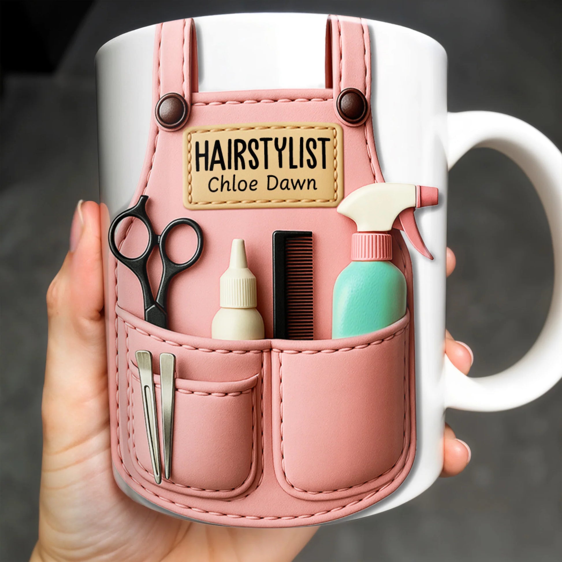 Personalized hairstylist mug with custom pink apron print containing scissors and comb - perfect gift for beauticians