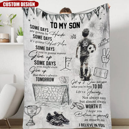 Personalized soccer blanket for boys featuring a custom name and jersey number next to an inspiring sports quote. image 6