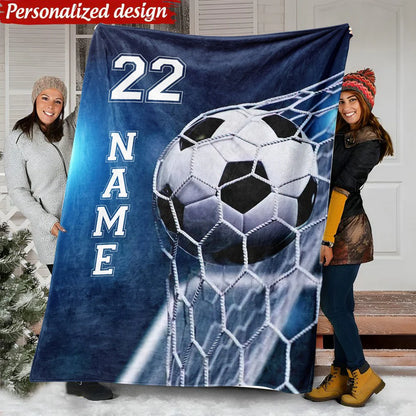 Personalized soccer blanket featuring custom name and player number 22 with a soccer ball in the net