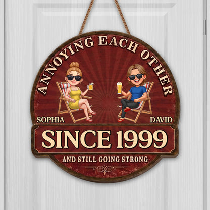 Personalized couple wood sign featuring a custom cartoon illustration on beach chairs with rustic details
