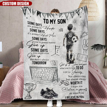 Personalized soccer blanket for boys featuring a custom name and jersey number next to an inspiring sports quote. image 7