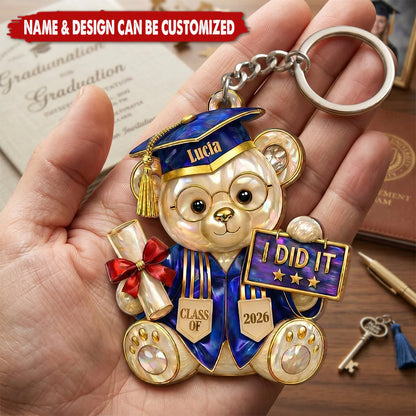 Personalized graduation bear keychain featuring a custom name and Class of 2026 gown design for graduates